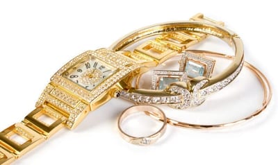 Golden clock and jewellery Golden clock and jewellery. Isolate on white background.